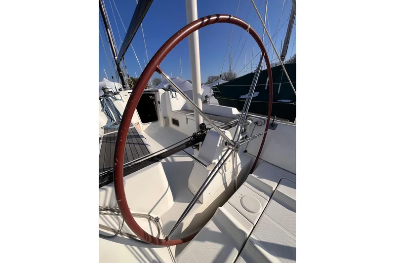Slide: The Image of 2007 Beneteau First 10R sailboat cockpit with large steering wheel and deck view. - 22