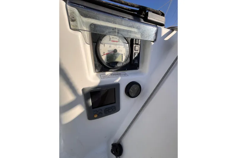 Slide: The Image of Control panel of 2007 Beneteau First 10R sailboat with gauges and display. - 24