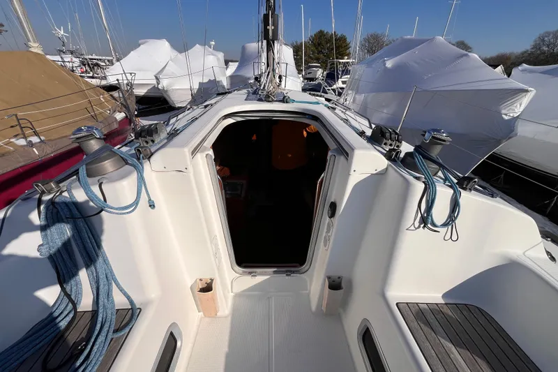 Slide: The Image of 2007 Beneteau First 10R sailboat cockpit with ropes and winches, docked in marina. - 28