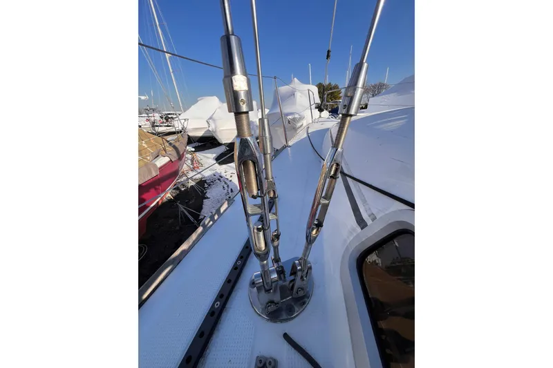 Slide: The Image of Close-up of rigging on a 2007 Beneteau First 10R sailboat deck. - 33