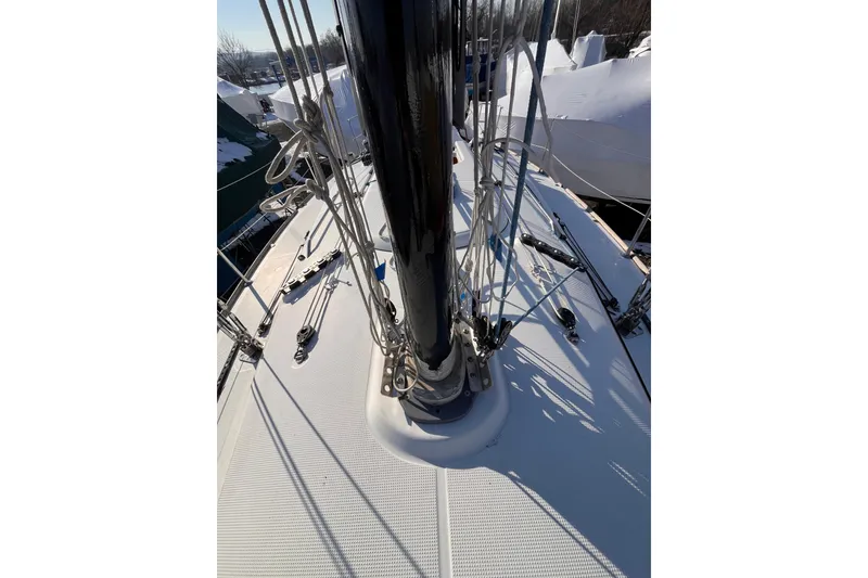 Slide: The Image of 2007 Beneteau First 10R sailboat deck with mast and rigging details. - 38