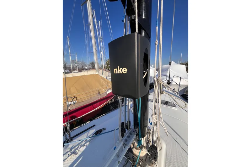 Slide: The Image of 2007 Beneteau First 10R sailboat deck with mast and rigging under clear blue sky. - 39