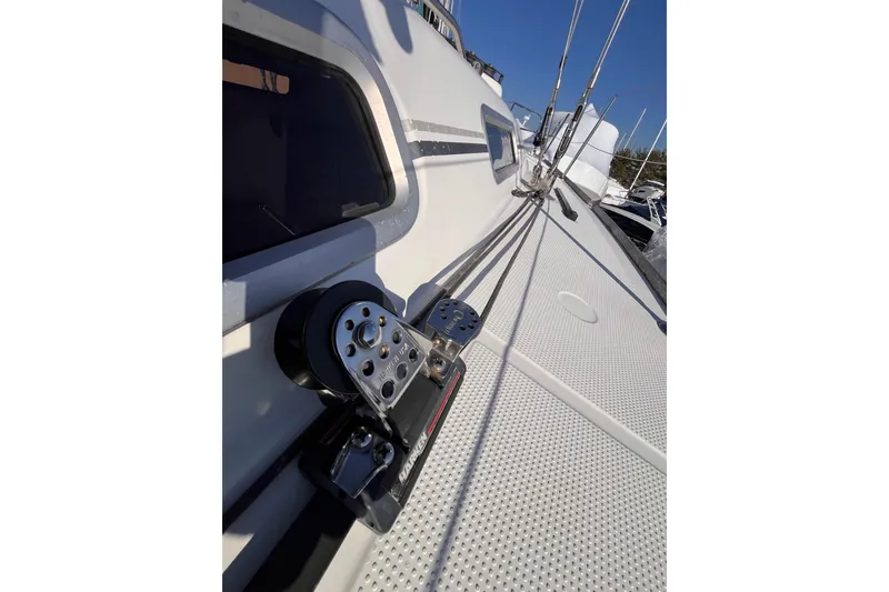 Slide: The Image of 2007 Beneteau First 10R sailboat deck with rigging and winch details. - 42