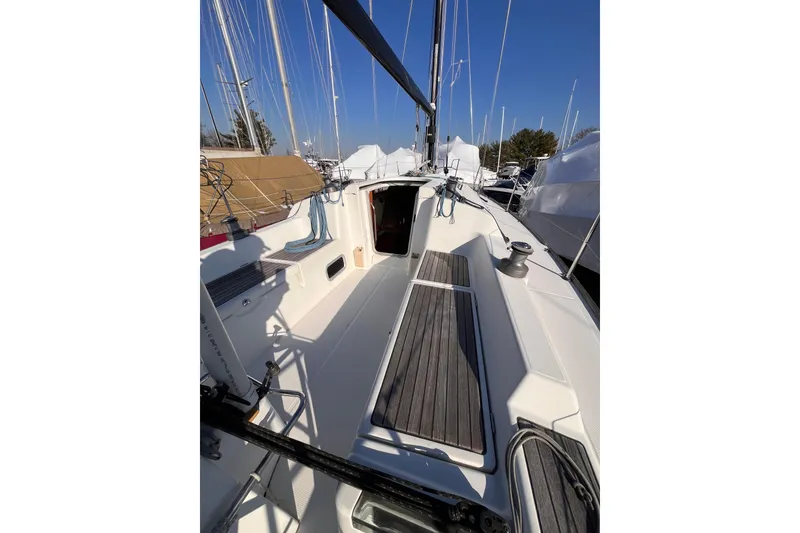 Slide: The Image of 2007 Beneteau First 10R sailboat cockpit with wooden seating and clear blue sky. - 43