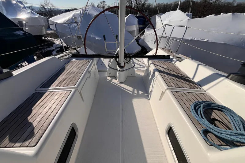 Slide: The Image of 2007 Beneteau First 10R sailboat cockpit with wooden seating and coiled rope. - 47