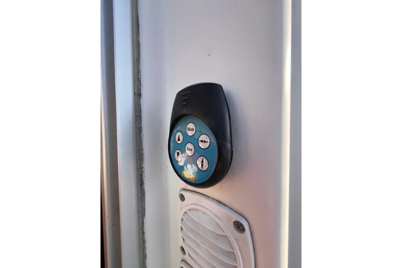 Slide: The Image of Control panel on 2007 Beneteau First 10R sailboat, featuring multiple buttons. - 49