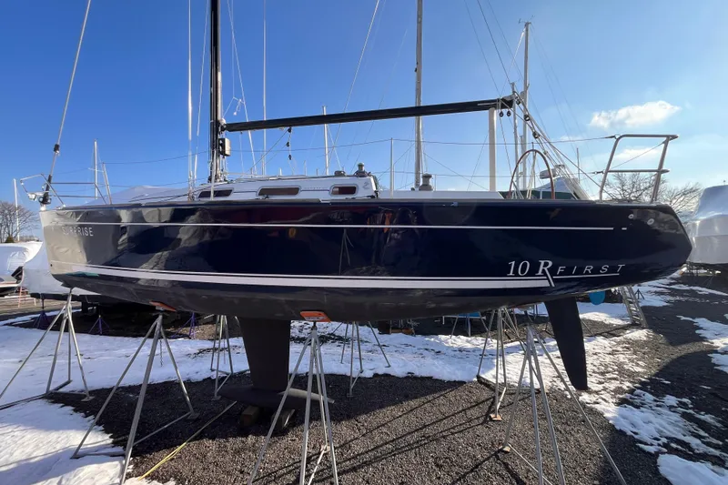 Slide: The Image of 2007 Beneteau First 10R sailboat on stands, winter setting, clear sky. - 5