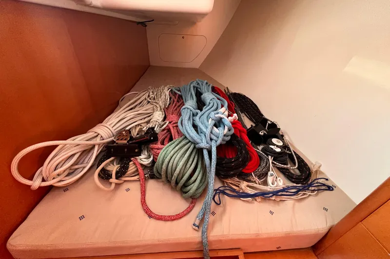 Slide: The Image of Coiled ropes and pulleys on a Beneteau First 10R sailboat, 2007 model. - 56