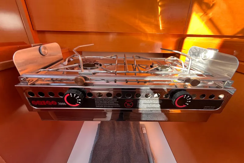 Slide: The Image of Stainless steel stove in 2007 Beneteau First 10R yacht interior. - 59