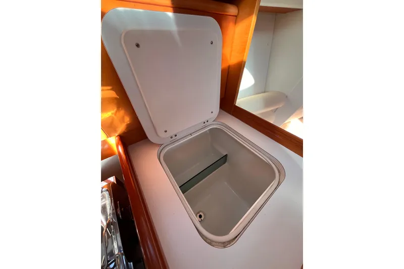 Slide: The Image of Open storage compartment in 2007 Beneteau First 10R sailboat interior. - 60