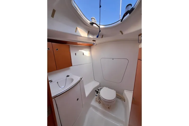 Slide: The Image of 2007 Beneteau First 10R yacht bathroom with skylight, sink, and toilet. - 70