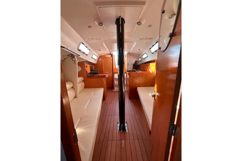 Slide: The Image of Interior of 2007 Beneteau First 10R sailboat with wood finish and seating. - 72