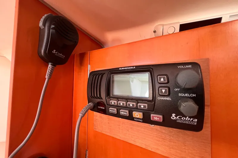 Slide: The Image of Cobra Marine radio system inside 2007 Beneteau First 10R yacht cabin. - 77