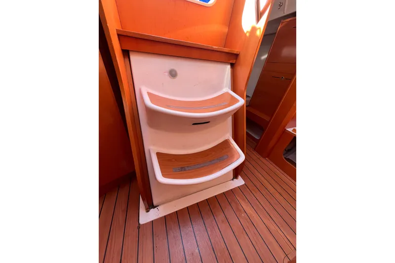 Slide: The Image of Interior steps of 2007 Beneteau First 10R sailboat with wooden flooring. - 81