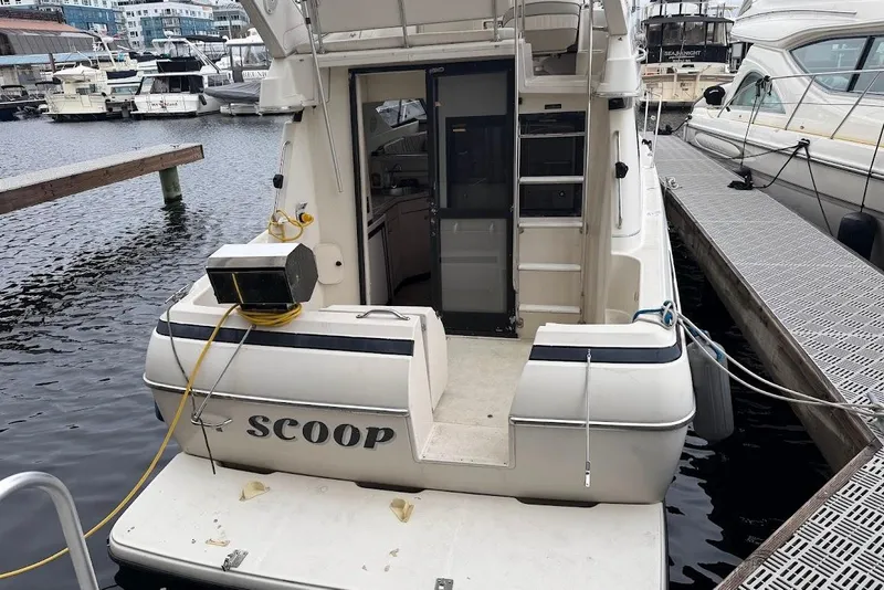 Slide: The Image of 2001 Bayliner 3258 Command Bridge docked at marina, rear view. - 11