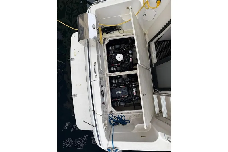 Slide: The Image of 2001 Bayliner 3258 Command Bridge engine compartment with open hatches and visible wiring. - 14