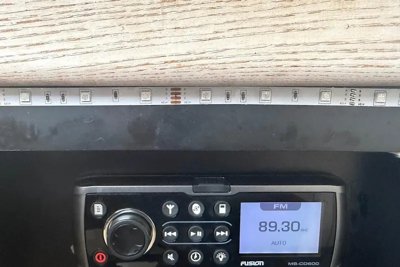 Slide: The Image of 2001 Bayliner 3258 Command Bridge radio display with LED strip lighting. - 7