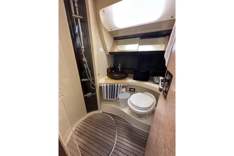 Slide: The Image of Luxurious bathroom in 2011 Azimut 38 yacht with modern fixtures and wooden flooring. - 15