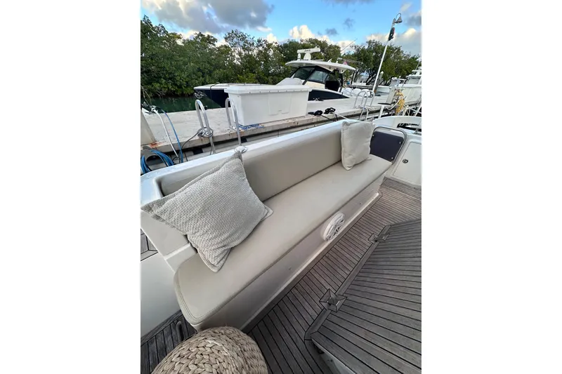 Slide: The Image of Azimut 38 yacht 2011 model, featuring a comfortable outdoor seating area with cushions. - 22