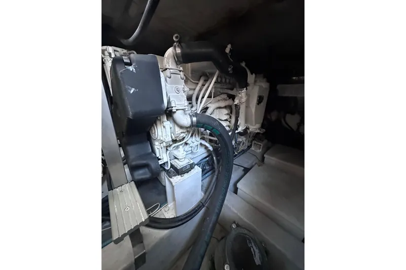 Slide: The Image of Engine compartment of a 2011 Azimut 38 yacht, showcasing mechanical components. - 34