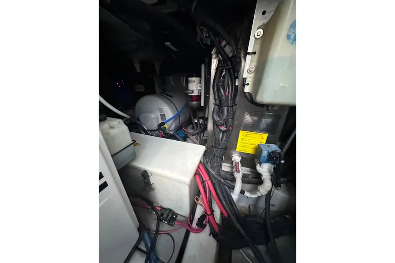 Slide: The Image of Engine room of 2011 Azimut 38 yacht, showcasing mechanical components and wiring. - 36