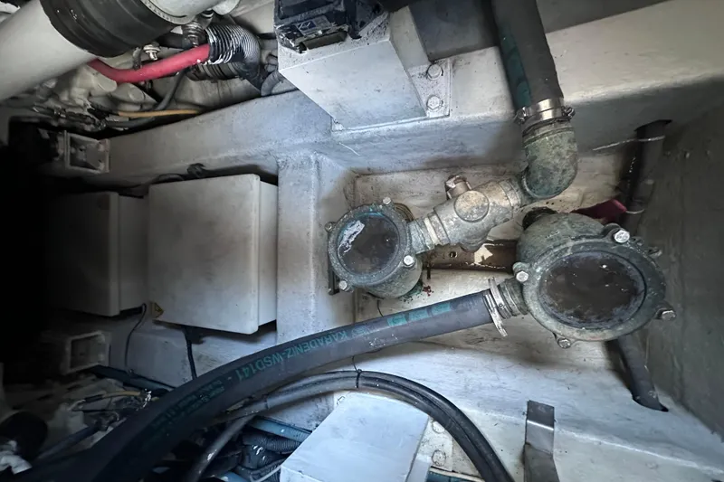 Slide: The Image of Engine compartment of a 2011 Azimut 38 yacht, showing pipes and mechanical components. - 39