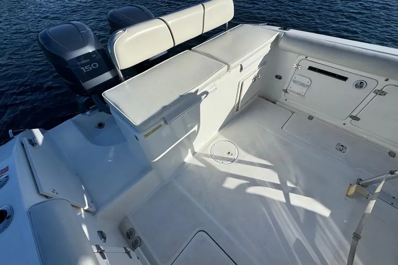 Slide: The Image of 2003 Century 2600 Center Console boat interior with Yamaha 150 engines. - 4