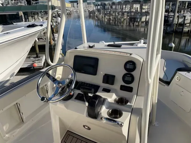 Slide: The Image of Interior view of 2023 Stingray 206 CC boat at dock. - 7