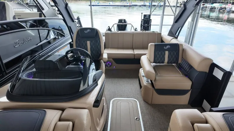 Slide: The Image of Interior of 2026 Barletta Lusso 25UA with luxurious seating. - 25