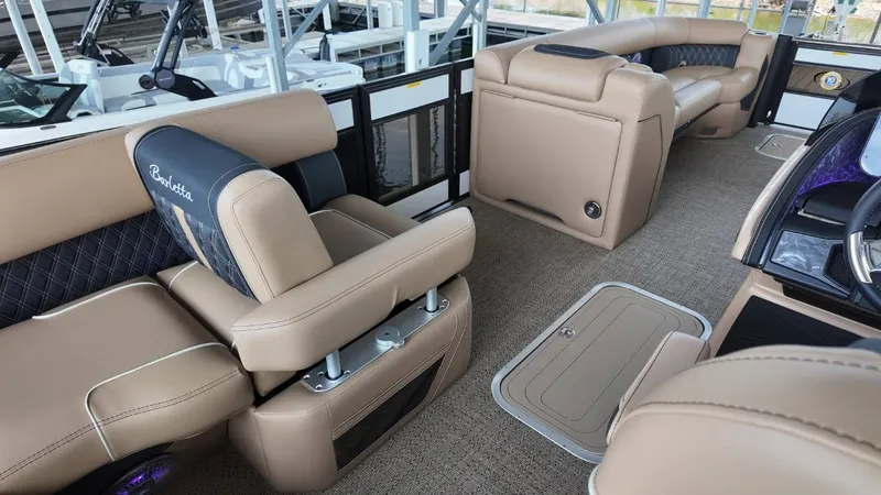 Slide: The Image of Interior of 2026 Barletta Lusso 25UA with luxurious seating. - 28