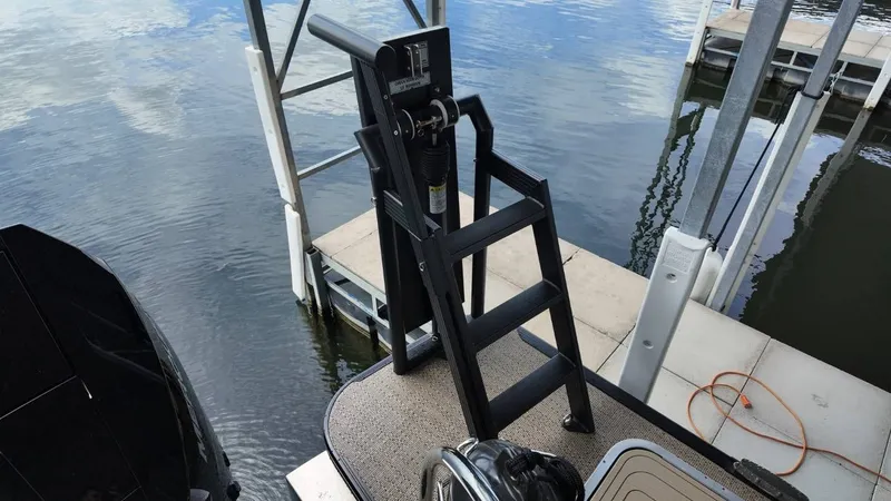 Slide: The Image of Barletta Lusso 25UA 2026 boat dock with ladder by the water. - 39