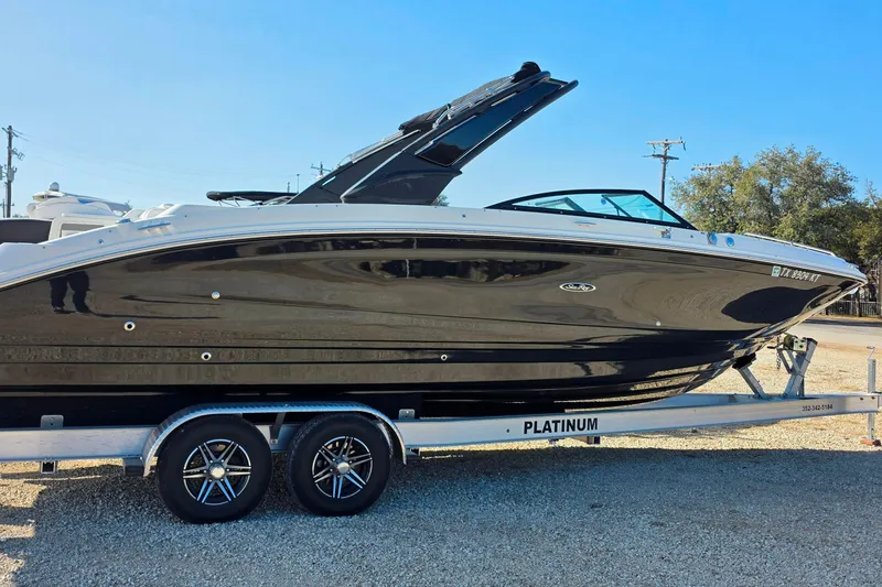 Slide: The Image of 2023 Sea Ray SDX 290 boat on trailer, side view. - 14