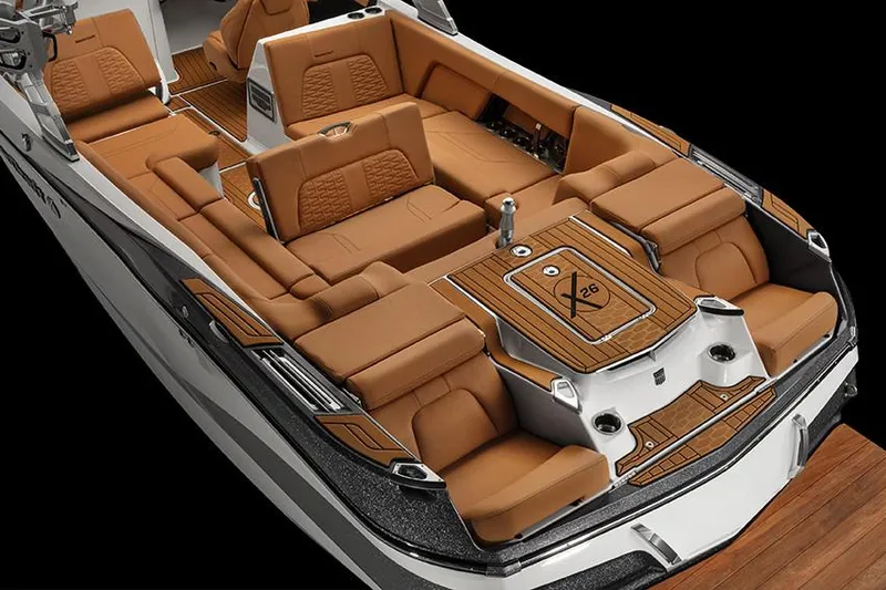 Slide: The Image of Manufacturer Provided Image: 2020 MasterCraft X26 boat interior with luxurious tan seating and teak accents. - 10