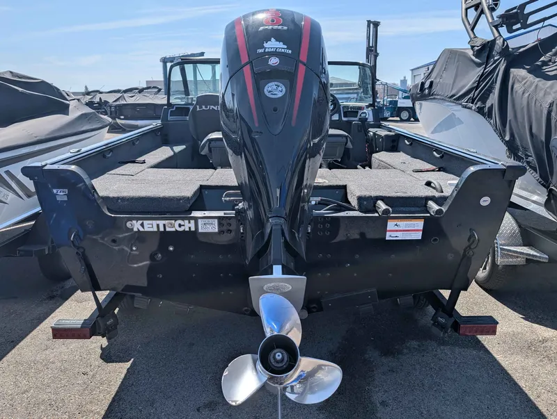 Slide: The Image of Rear view of a 2023 Lund 1875 Impact boat with outboard motor. - 14