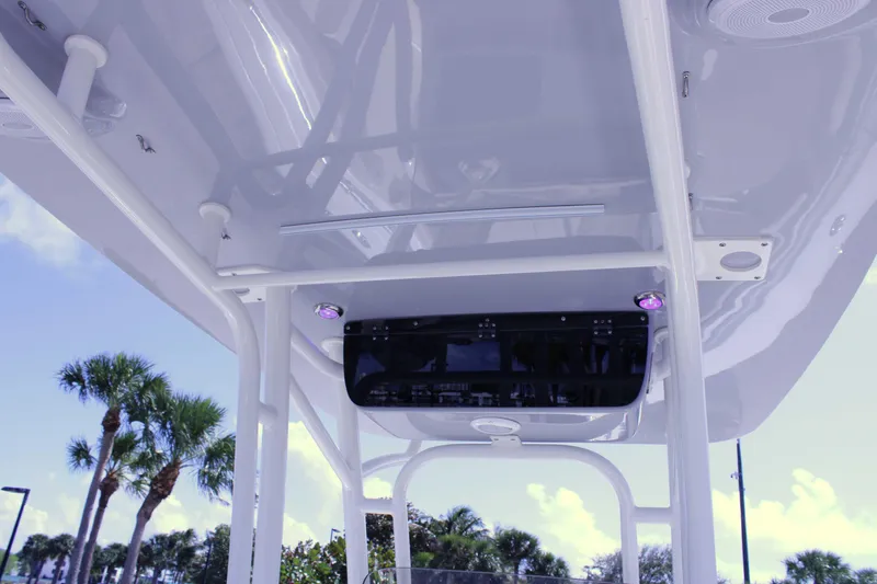 Slide: The Image of 2021 Key West 239 FS boat interior with modern console and overhead view. - 19