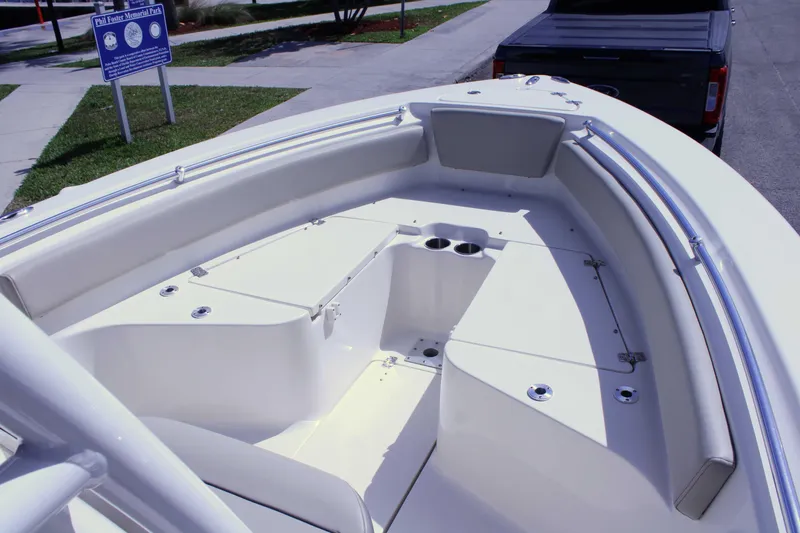 Slide: The Image of 2021 Key West 239 FS boat interior with seating and storage compartments. - 23