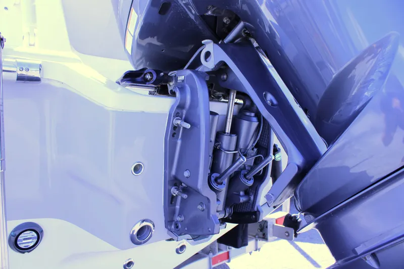 Slide: The Image of 2021 Key West 239 FS boat engine close-up, showcasing motor and mounting details. - 28