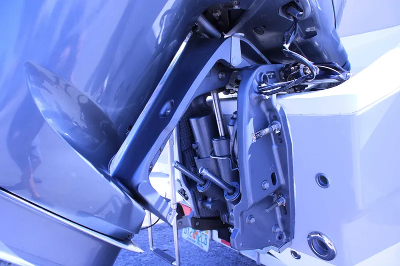 Slide: The Image of 2021 Key West 239 FS boat engine close-up, showcasing mechanical components and wiring. - 29