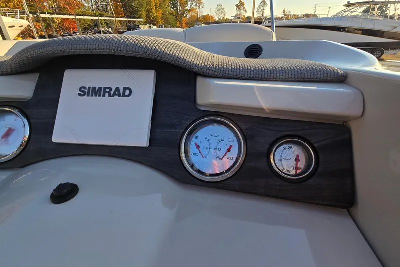 Slide: The Image of Dashboard of 2017 Crest Classic 230 SLC boat with Simrad display and gauges. - 25