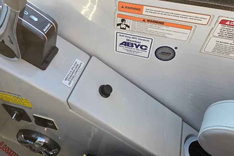 Slide: The Image of Control panel of 2017 Crest Classic 230 SLC boat with safety warnings and ABYC certification. - 26