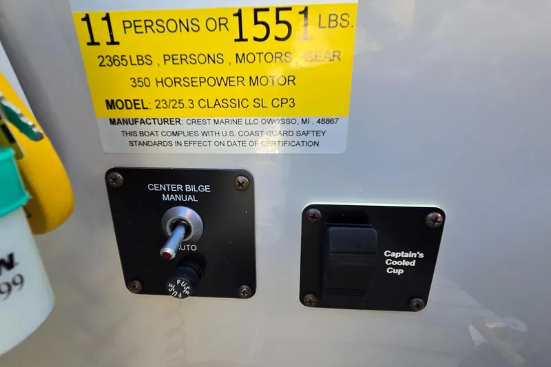 Slide: The Image of Control panel of 2017 Crest Classic 230 SLC boat, showing capacity and safety compliance. - 28