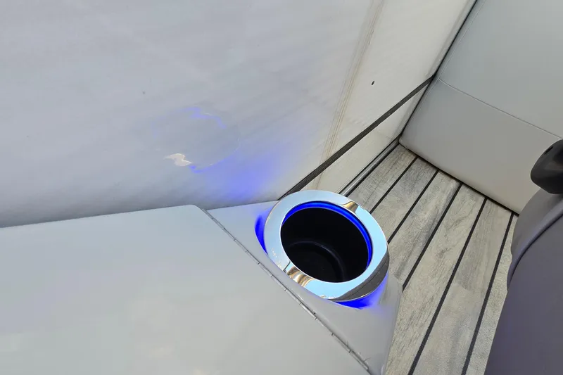 Slide: The Image of Cup holder with blue LED light on 2017 Crest Classic 230 SLC boat interior. - 32