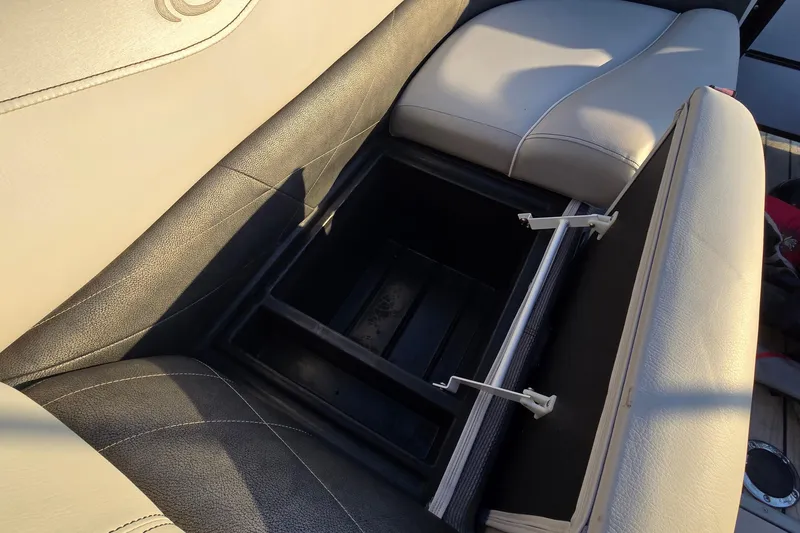 Slide: The Image of Open storage compartment in 2017 Crest Classic 230 SLC boat seat. - 39