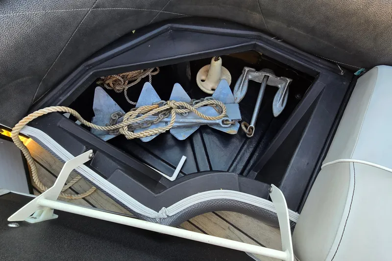 Slide: The Image of Storage compartment with anchor and rope on 2017 Crest Classic 230 SLC boat. - 40