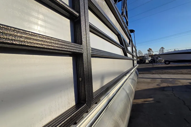 Slide: The Image of Side view of a 2017 Crest Classic 230 SLC pontoon boat in a marina. - 41