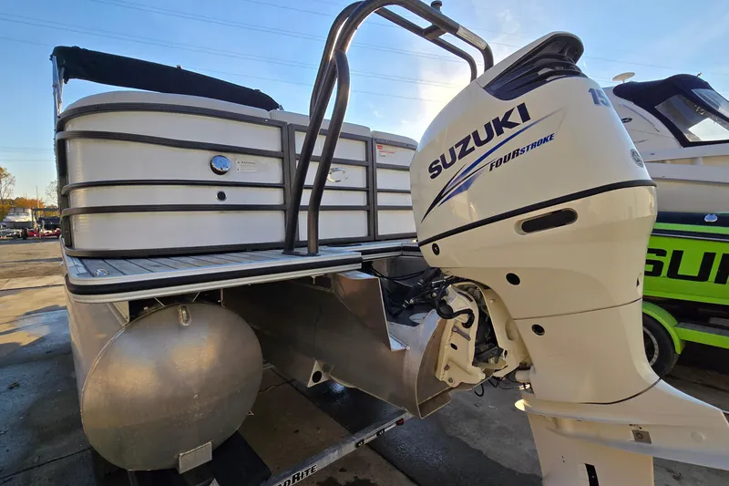 Slide: The Image of 2017 Crest Classic 230 SLC pontoon boat with Suzuki outboard motor. - 5