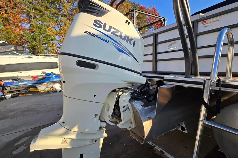 Slide: The Image of Suzuki four-stroke outboard motor on 2017 Crest Classic 230 SLC pontoon boat. - 7