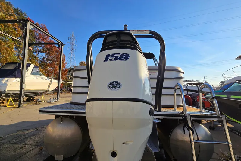 Slide: The Image of 2017 Crest Classic 230 SLC pontoon boat with 150 HP engine in a marina. - 8