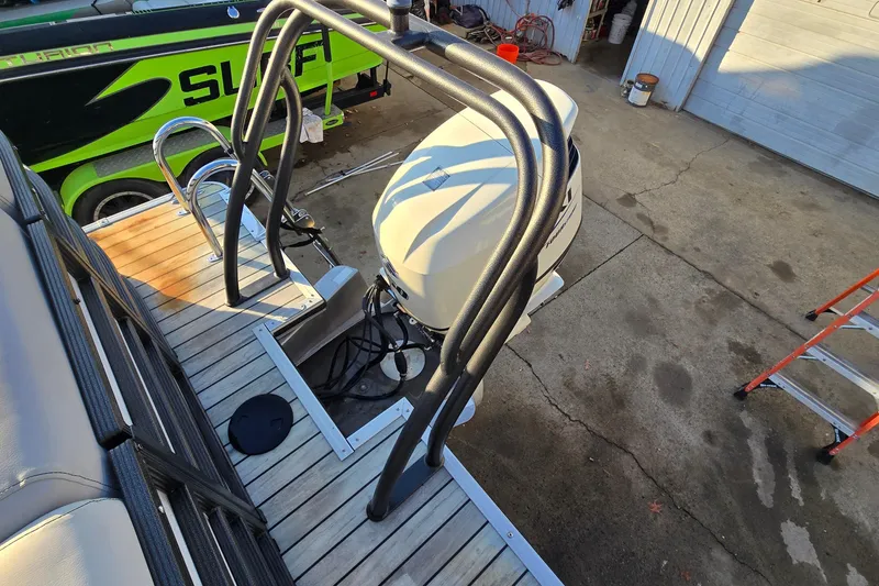 Slide: The Image of 2017 Crest Classic 230 SLC boat with outboard motor and swim ladder on dock. - 9