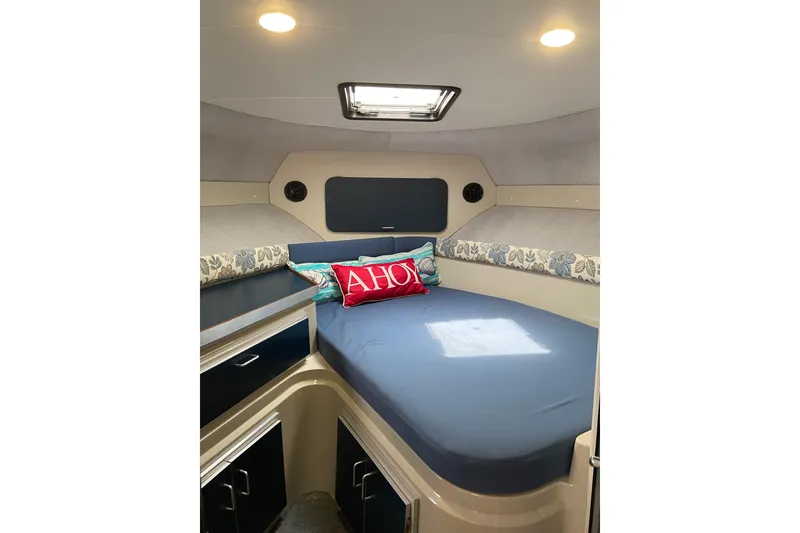 Slide: The Image of Interior cabin of 1987 Carver 32 Montego boat with cozy bed and nautical decor. - 11